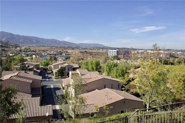 birds eye view of property with a mountain view