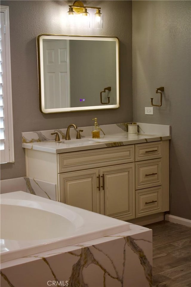 bathroom featuring vanity and wood-type flooring