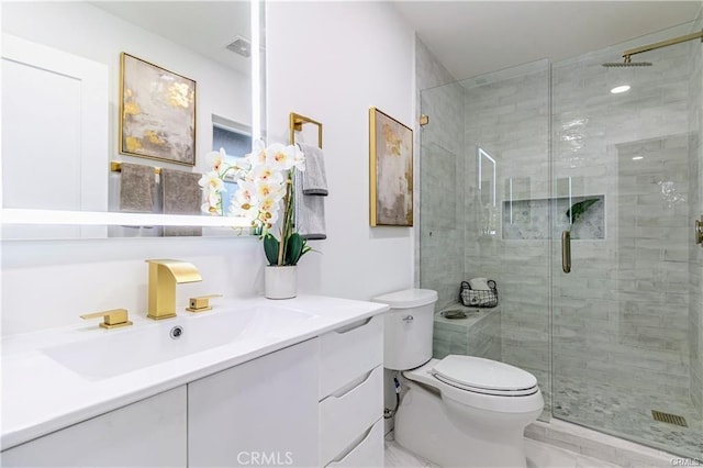 bathroom with toilet, an enclosed shower, and vanity