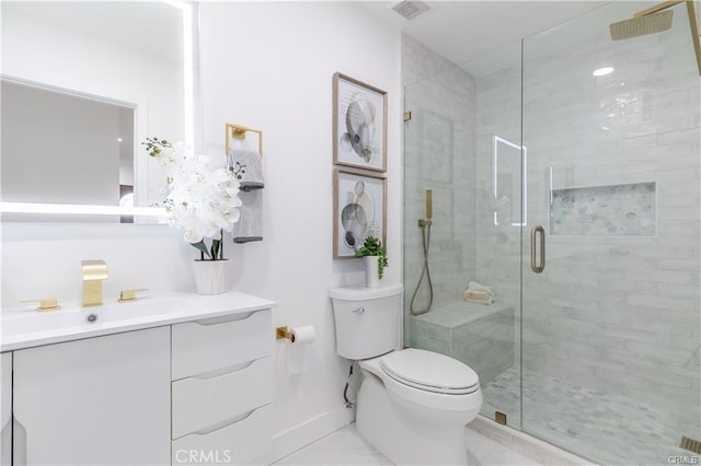 bathroom featuring vanity, toilet, and a shower with shower door