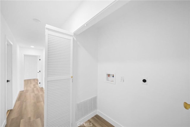 laundry room with light hardwood / wood-style floors, electric dryer hookup, and hookup for a washing machine