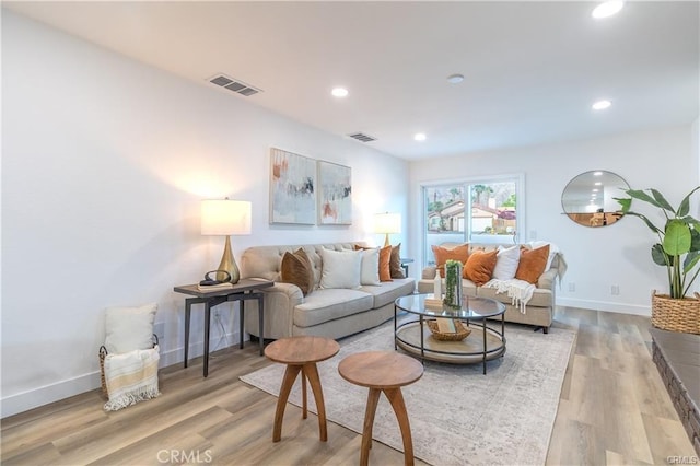 living room with light hardwood / wood-style floors