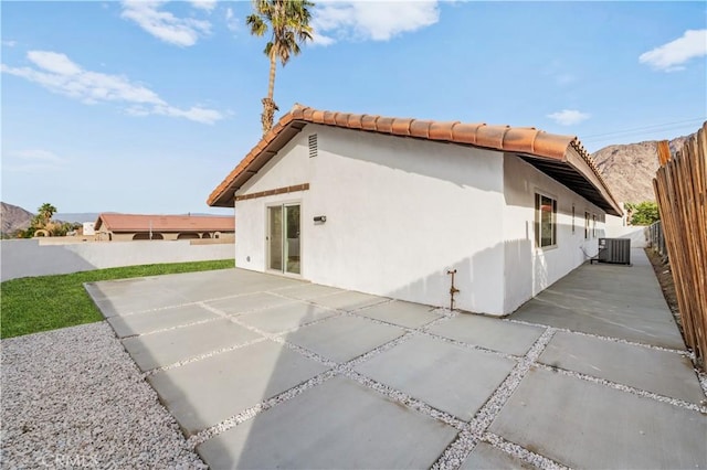 view of home's exterior with a patio area and central air condition unit