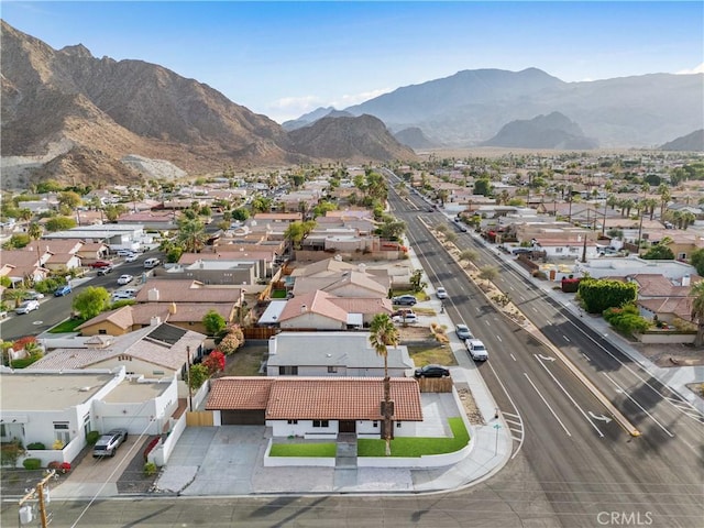 birds eye view of property with a mountain view