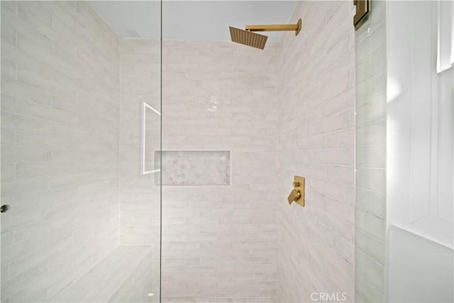 interior space with a tile shower