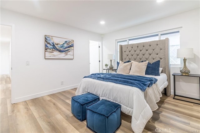 bedroom with light hardwood / wood-style floors