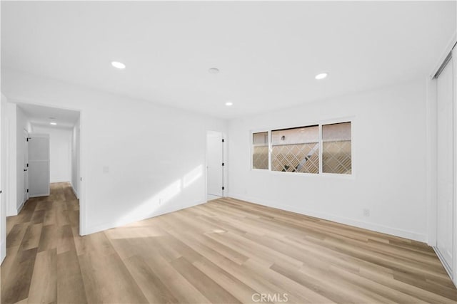 spare room with light hardwood / wood-style floors