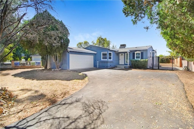 ranch-style house featuring a garage