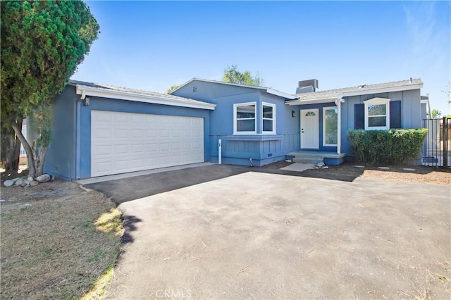 ranch-style house featuring a garage