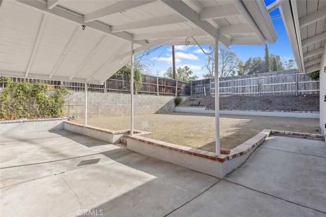 view of yard with a fenced backyard and a patio