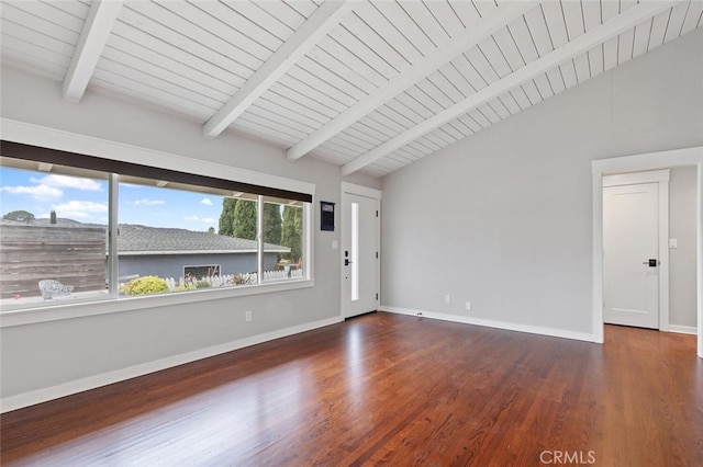 unfurnished room with vaulted ceiling with beams, baseboards, and wood finished floors