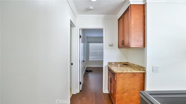 hall featuring dark hardwood / wood-style floors and crown molding