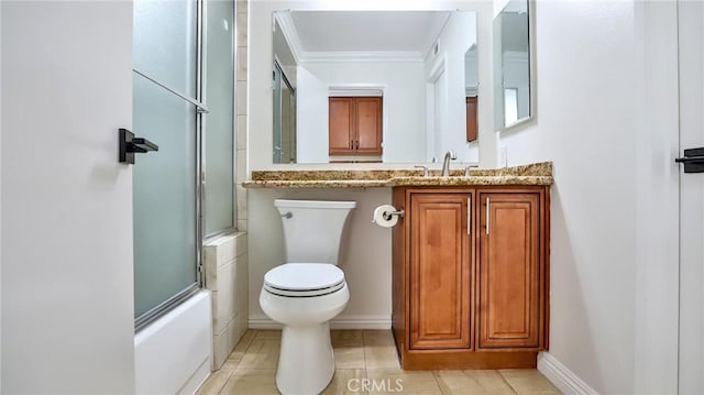 full bathroom featuring toilet, combined bath / shower with glass door, tile patterned floors, crown molding, and vanity