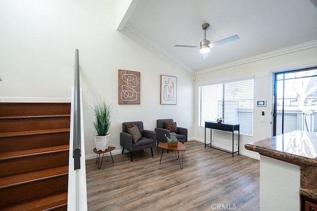 sitting room with ceiling fan, vaulted ceiling, crown molding, and hardwood / wood-style flooring