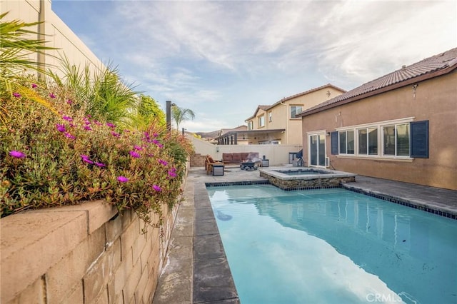 view of swimming pool featuring an in ground hot tub