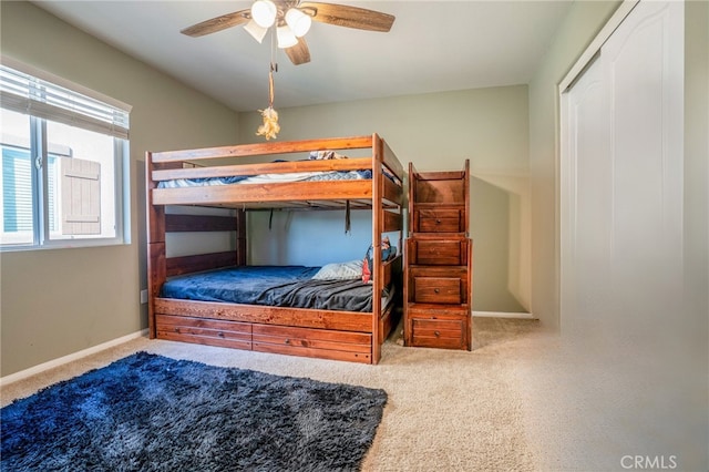 carpeted bedroom featuring ceiling fan