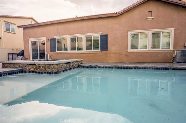 view of swimming pool featuring central AC