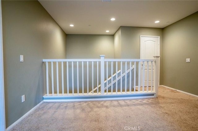 corridor with carpet flooring