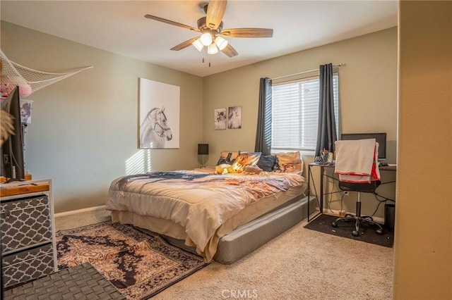 bedroom with ceiling fan and carpet