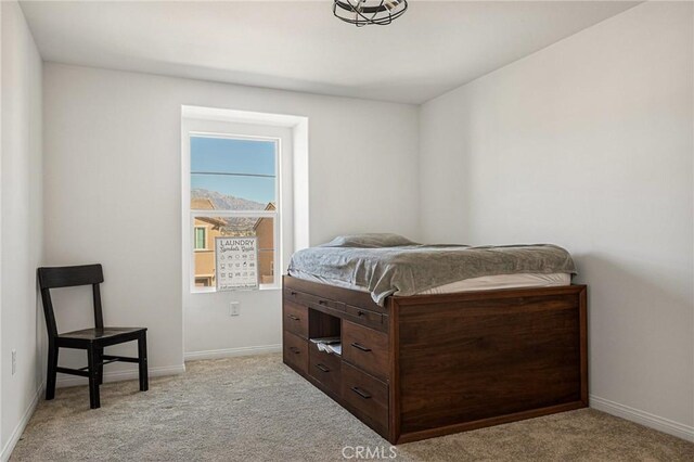 bedroom with light carpet