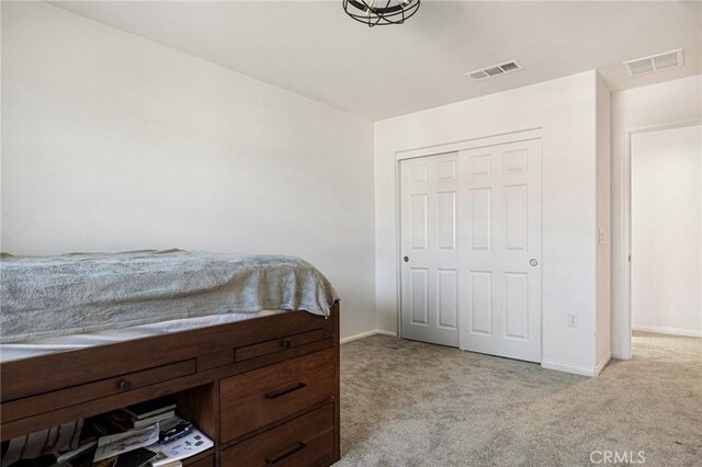 carpeted bedroom with a closet