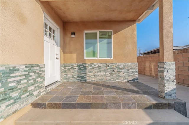 entrance to property with a patio area