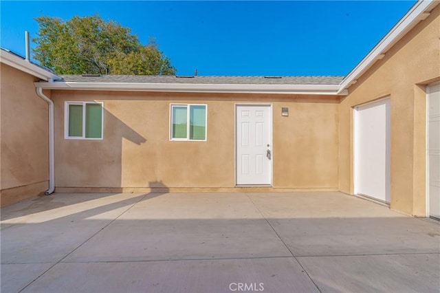 doorway to property with a patio