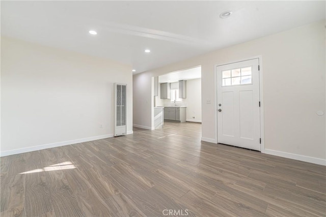 entryway with hardwood / wood-style flooring