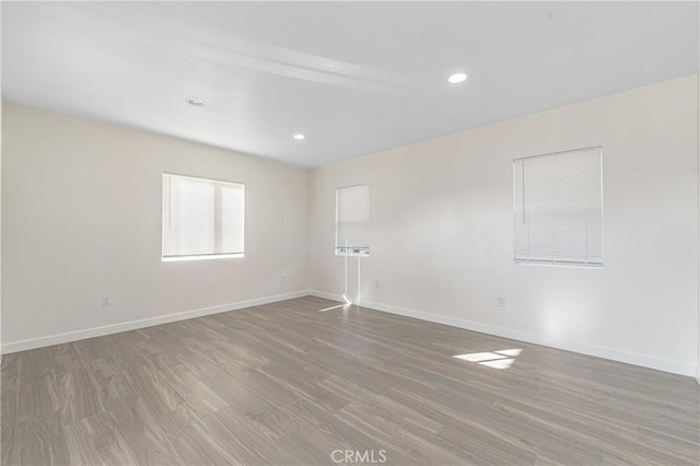 unfurnished room featuring wood-type flooring