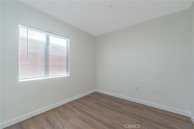 empty room featuring hardwood / wood-style flooring