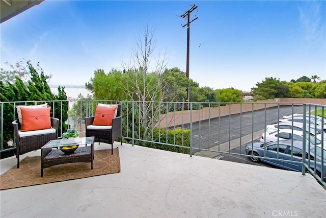 view of patio featuring a balcony