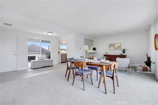 dining area with light carpet