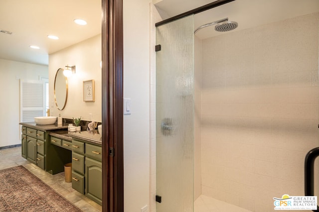 bathroom with walk in shower and vanity