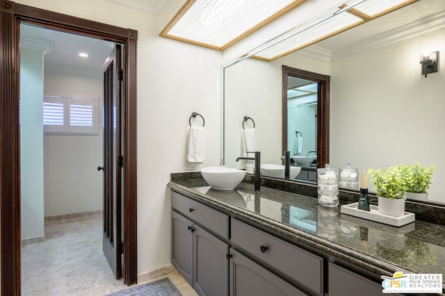 bathroom with tile patterned floors, vanity, and ornamental molding