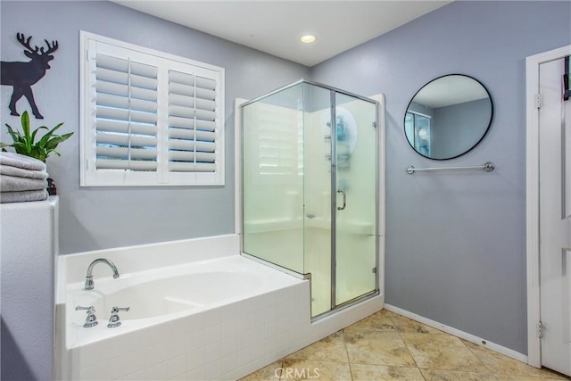 bathroom with independent shower and bath and tile patterned flooring