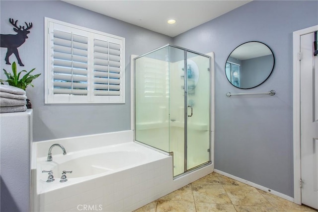 bathroom featuring baseboards, a shower stall, recessed lighting, and a garden tub