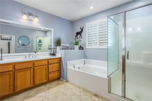 full bathroom with visible vents, vanity, tile patterned floors, a stall shower, and a garden tub