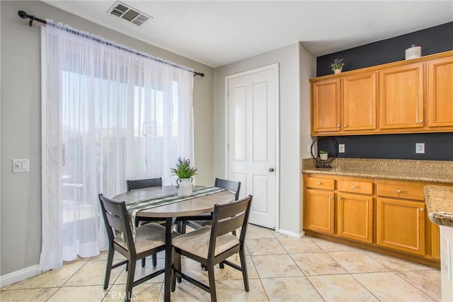 dining room with light tile patterned flooring