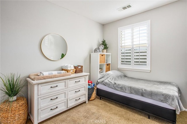 bedroom featuring light colored carpet