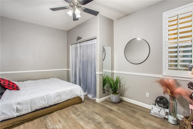 bedroom featuring ceiling fan and hardwood / wood-style floors