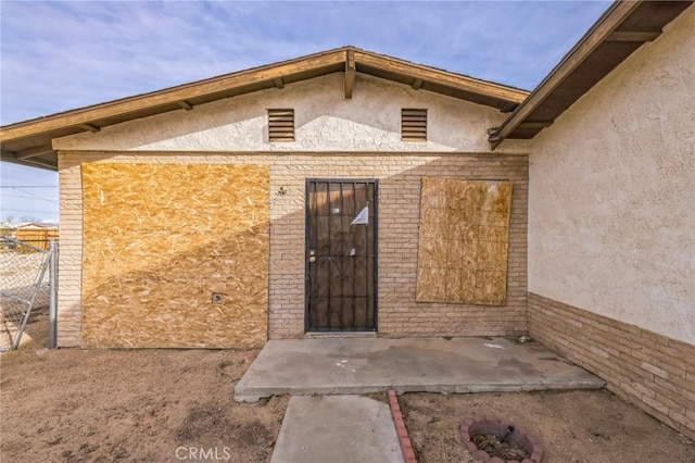 property entrance with a patio