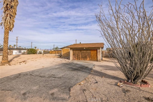 view of outbuilding with a garage