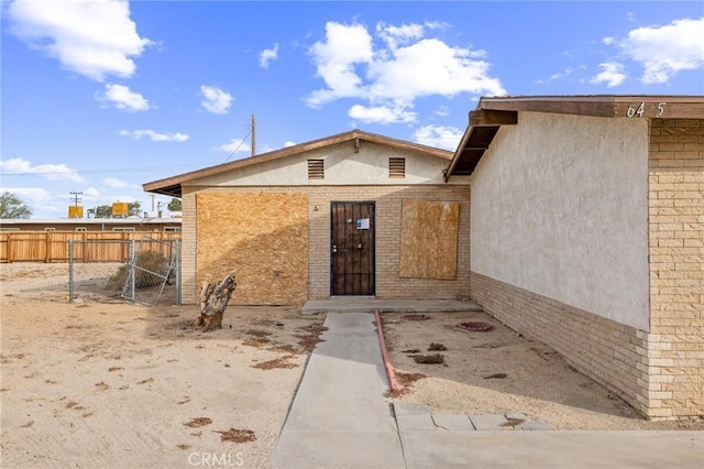 property entrance with a patio area