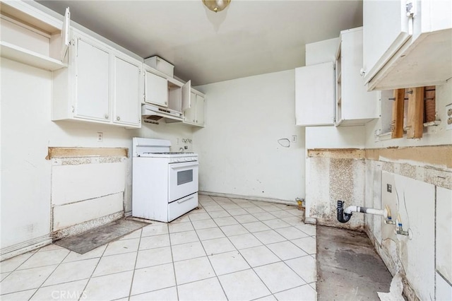 kitchen with white cabinets, light tile patterned floors, and white gas range