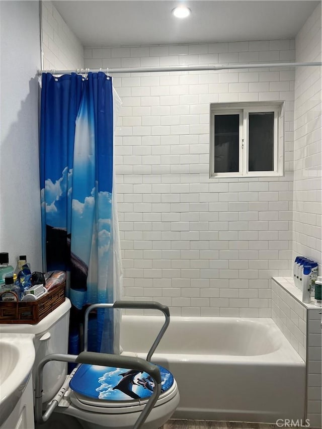 full bathroom featuring toilet, vanity, and shower / tub combo