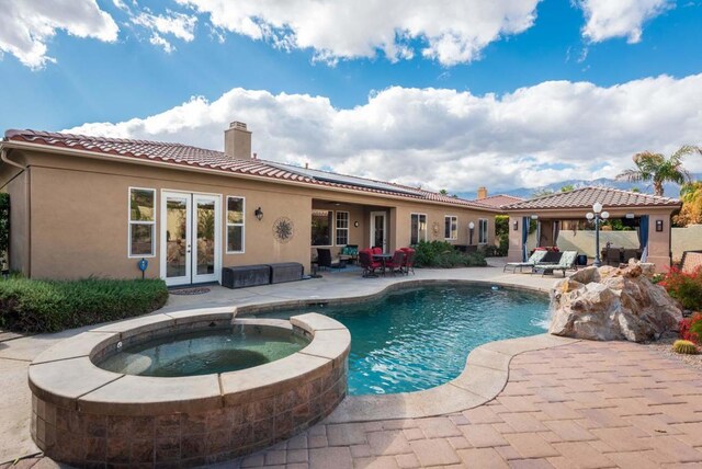 view of pool with pool water feature, a patio area, a gazebo, and an in ground hot tub