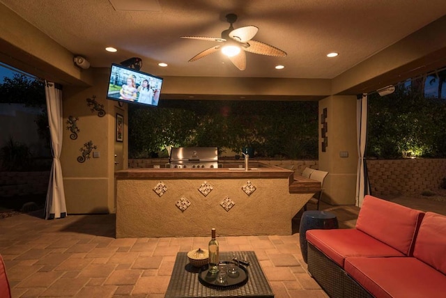 view of patio / terrace with ceiling fan, area for grilling, sink, grilling area, and an outdoor hangout area