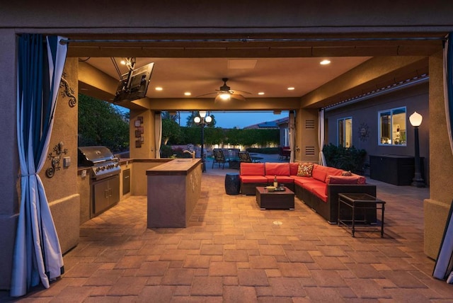 view of patio with an outdoor living space, a grill, and area for grilling