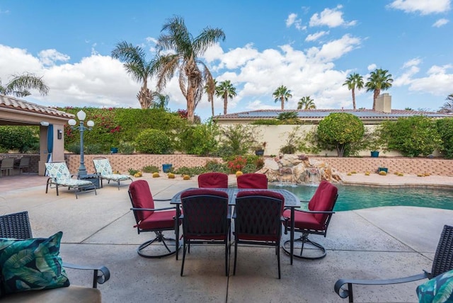 view of patio / terrace featuring a fenced in pool