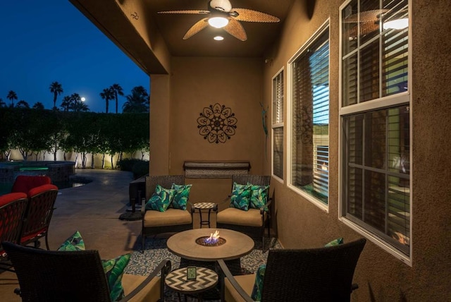 view of patio / terrace with ceiling fan, an in ground hot tub, and an outdoor hangout area